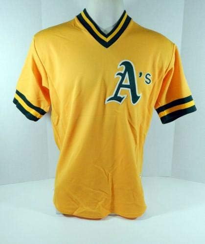 1980'lerin Sonlarında Oakland Atletizm 56 Oyunu Kullanılmış Altın Jersey Vuruş Uygulaması DP04748-Oyun Kullanılmış MLB Formaları